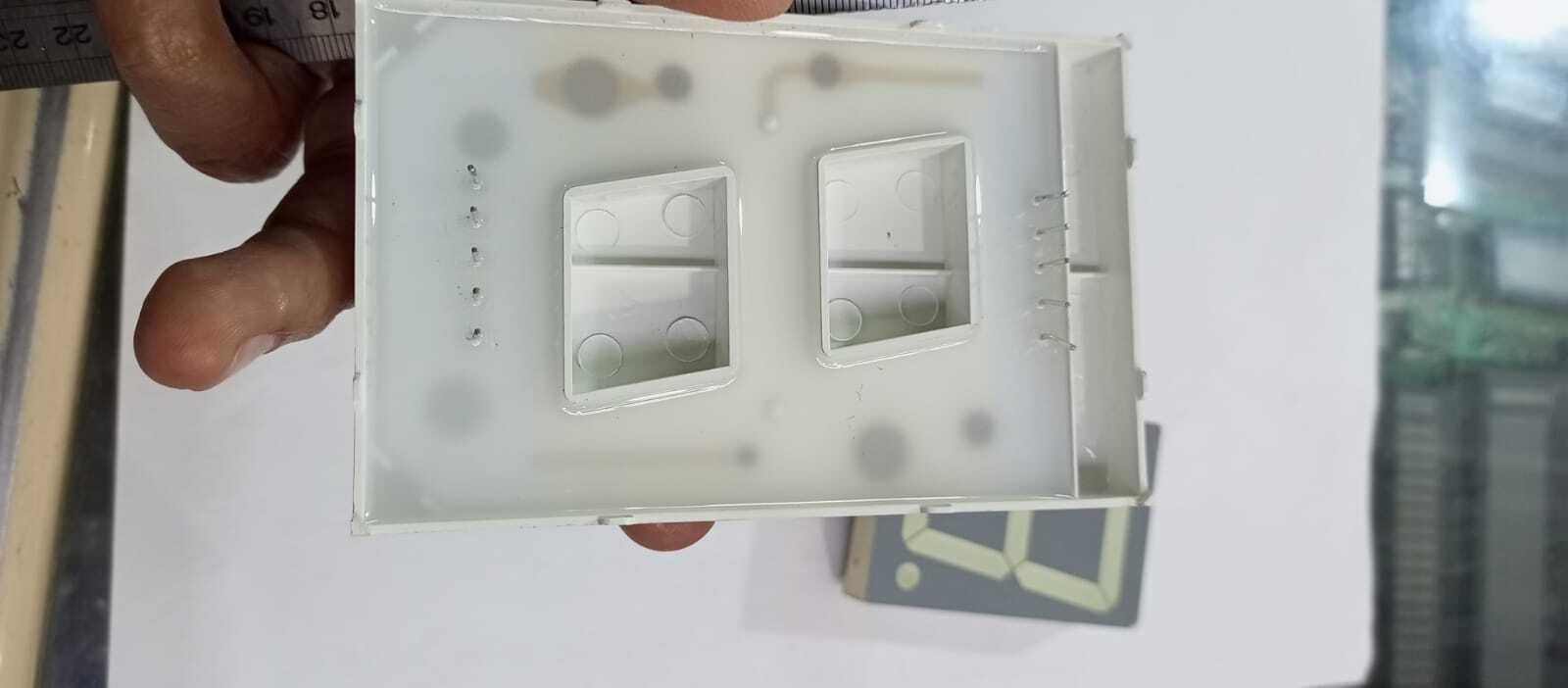 Green color 7 segment - shown from the back with visible pins, alongside a separate front-facing segment display piece.