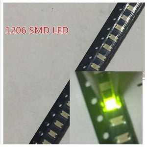 Green SMD 1206 LED Super Bright Light Emitting Diode - shown in a close-up view of multiple units on a black carrier tape, with one LED illuminated green.