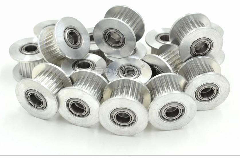 Gt-2 Idler Pulley Series 20T 10mm Belt Size 5mm Bore With Teeth - a pile of silver aluminum toothed pulleys with integrated ball bearings.