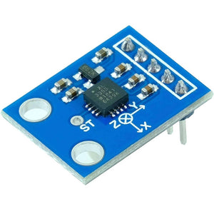 Gy-61 Triple Axis Accelerometer ADXL335 - a blue rectangular circuit board with a central sensor chip, surface-mount components, and a five-pin header.