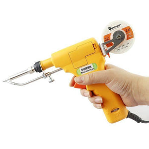 Hand-held Heating Soldering Iron 110V / 220V 60W / 80W mannual Soldering gun - a yellow hand-held tool with a metal tip, a trigger, and a spool of solder wire attached to the top, held in a person's hand.