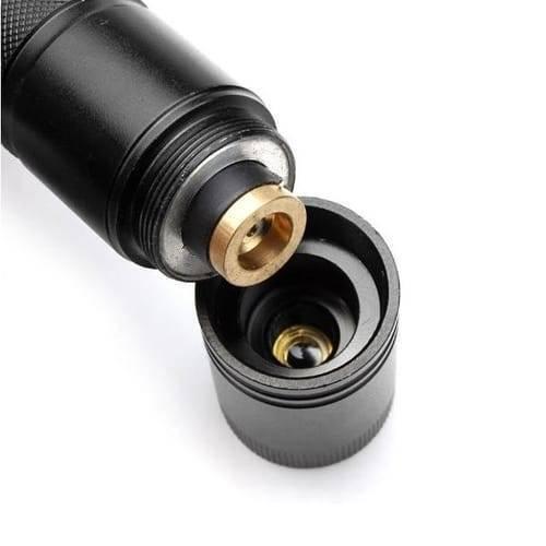 Handheld Focusable Green Laser Pen Zh 303 Rechargeable 100mW High Beam Green Laser Hunting Pointer - a close-up view showing the black metal body with its detachable front lens cap and internal brass connector.