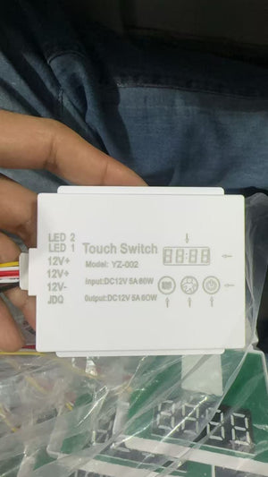Handy DC12V 5A 60W Single Button Mirror Touch Sensor Switch With Time Temperature Display Screen Touch Sensor Switch For Mirrors - a white rectangular control box with wiring, touch icons, and a digital display screen in packaging.