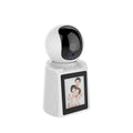 Hbs-1538 WiFi Video Calling Camera 2MP (1080P) – Smart Security With V380 App - a white, spherical security camera mounted on a base with a vertical screen displaying a photo of a family.