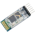 Hc 05 Bluetooth Module - a blue circuit board with a gold-patterned antenna, a central black chip, and a six-pin connector header.