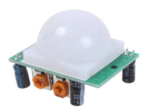 HC-SR501 PIR Motion Sensor Module Hw-416-b - a white dome lens, a green circuit board, two orange potentiometers, and two black capacitors.