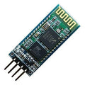 HC06 Bluetooth Module - a rectangular green circuit board with two black integrated circuit chips, a gold antenna pattern, and four metal header pins.