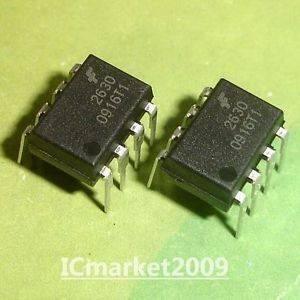 HCPL2630 2630 Optocoupler - two black 8-pin dual in-line package integrated circuits shown from a high-angle view on a green surface.
