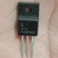 HCS80R380S 800V N-Channel Super Junction MOSFET (TO-220FS) Used - a black TO-220FS package electronic component with three metal pins, shown in a close-up view held against a palm.