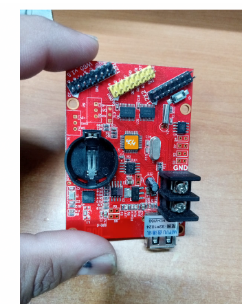 HD-W60 LED Control Card With WiFi LED Controller Card - a red rectangular circuit board featuring a battery holder, USB port, terminal block, headers, and various electronic components.