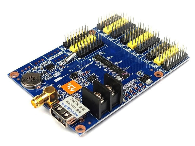 HD-W63 WiFi + USB Asynchronous LED Control Card - a blue circuit board featuring multiple yellow pin headers, a USB port, antenna connector, and terminals.