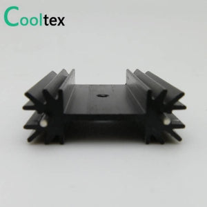 Heat Sink TO-3p Package And TO-220 - a black extruded aluminum heat sink with a central mounting hole and finned sides shown from a front-facing angle.