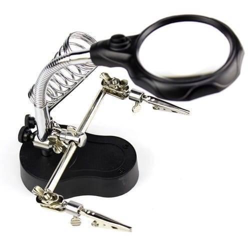 Helping Hand Clip Desktop LED Light Magnifier Glass With Soldering Stand 3.5x 12x - a black base, two adjustable metal alligator clips, and a magnifier.