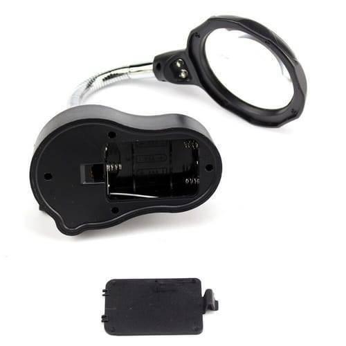 Helping Hand Clip Desktop LED Light Magnifier Glass With Soldering Stand 3.5x 12x - the black base with an open battery compartment and its detached cover, connected to a flexible arm.