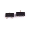 Hf SMD NPN, 15V, 0,1A, 0,5W, Sot-23 - two small black rectangular electronic components with three metal pins each, shown from the top view against a white background.