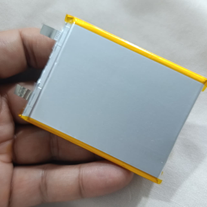 Hh 505573 LiPo Battery 2500mAh 3.7V For Laptop Battery Replacement - a rectangular, silver-colored lithium-polymer battery with two metal contact tabs held in a hand.