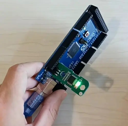 Hiata Arduino Mega Bootloader Burner Offline Standalone Isp Programmer - shown connected to a blue Arduino Mega board with a green LED illuminated.