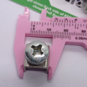 High Current Screw Terminal Connector - shown in a close-up view being measured by a pink plastic vernier caliper.
