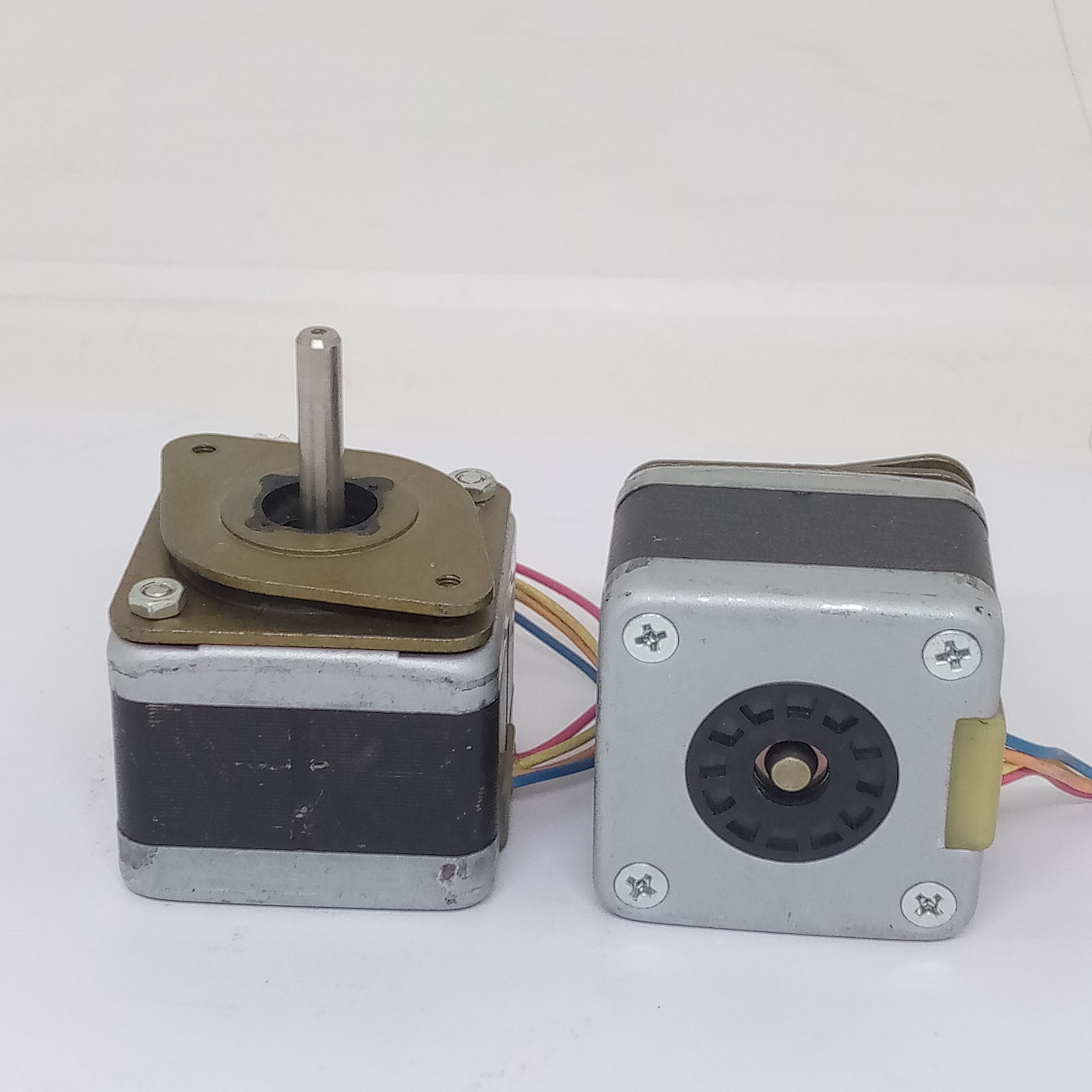 High-precision Stepper Motor NEMA17 5 To 24V DC For Precise Positioning Applications - with shafts and multi-colored wire connectors.