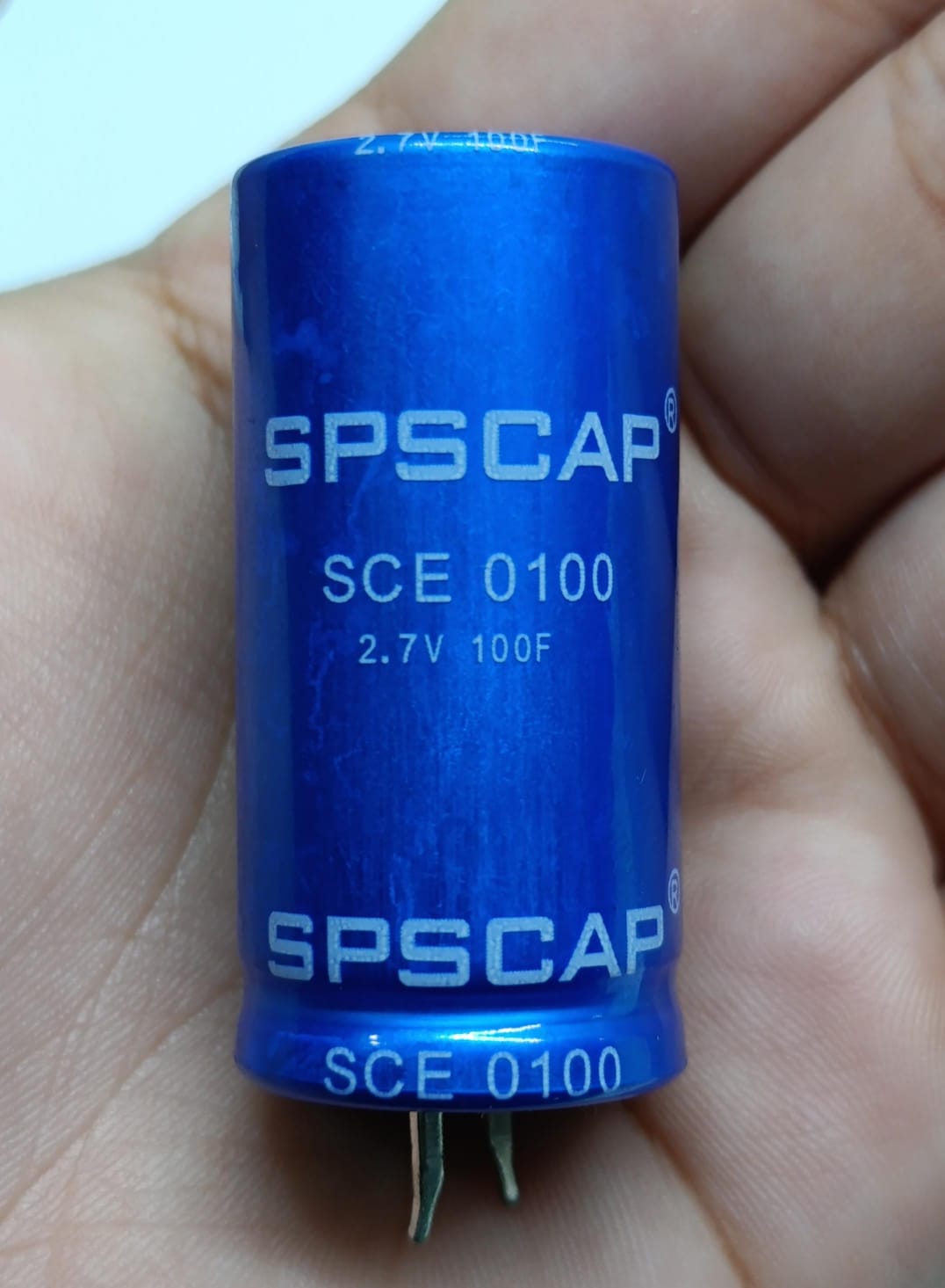 High Quality 2.7V 100F Super Capacitor - a blue cylindrical body with SPSCAP, SCE 0100, and 2.7V 100F printed on the side.