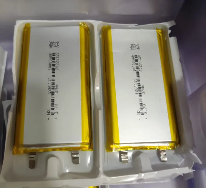High Quality 3.7V 10000mAh 1260110 Polymer Lithium Ion Li-ion Rechargeable Battery For Toy Power Bank GPS Table E-book Batteries - two rectangular silver cells with yellow tape edges and metal contact tabs in white plastic packaging.