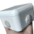 High Quality ABS Plastic Junction Box Universal Electrical Project Enclosure 100x100x65mm - a white square plastic box held in a hand.