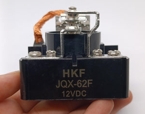 High Quality Low Price Industrial Large 12V DC 80A Power Relay - a black rectangular relay with screw terminals and a copper braided wire.