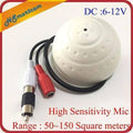 High Sensitivity Mini Cctv Security Surveillance Microphone – Audio Input For Ip Cameras, Dvr & Nvr Systems (50–150M² Range) - a white dome-shaped microphone with a black cable featuring a white RCA connector and a red DC power jack.