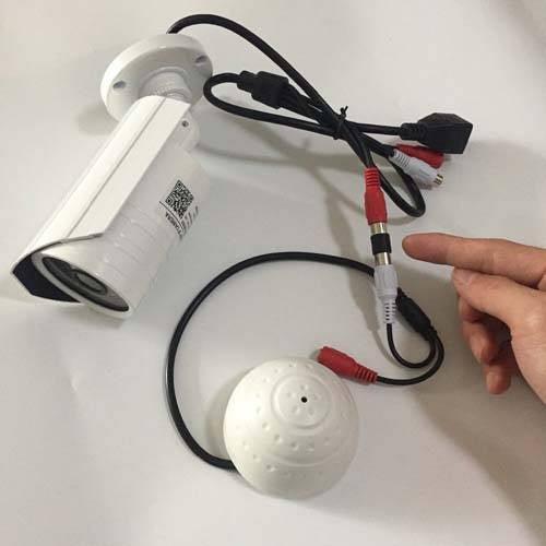 High Sensitivity Mini Cctv Security Surveillance Microphone – Audio Input For Ip Cameras, Dvr & Nvr Systems (50–150M² Range) - connected to a white bullet-style CCTV camera via red and white RCA audio connectors.