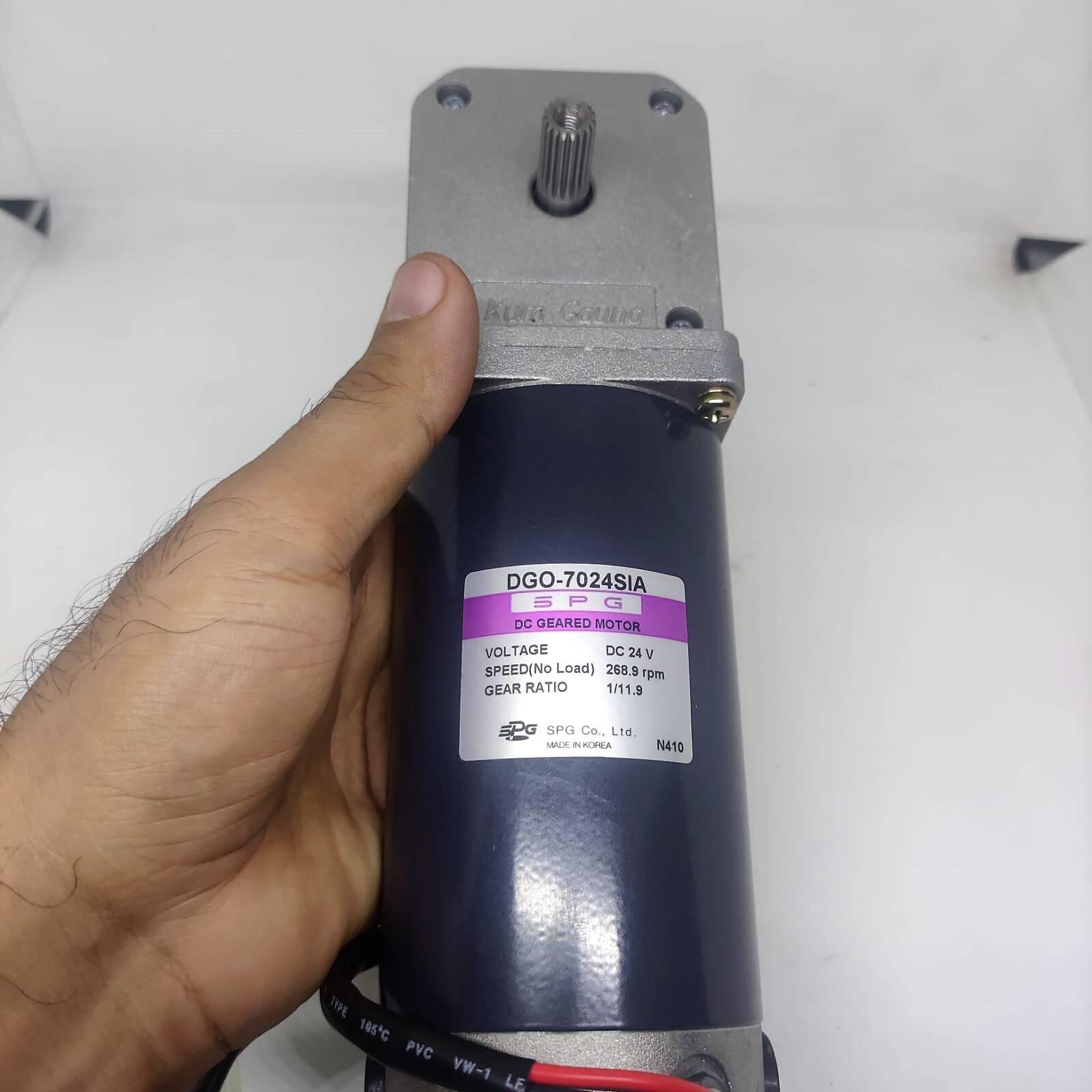 High Torque Gear Motor For Electric Bicycle Electric Cycle Electric Bike Price - a blue cylindrical DC geared motor with a silver gearbox and output shaft, held in a hand showing the DGO-7024SIA spec label.