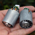 High-voltage Brushless Ducted Fan 110000 RPM Edf Motor With Aluminum Alloy Impeller & Variable Frequency Control - impellers and small green circuit boards held in a hand.
