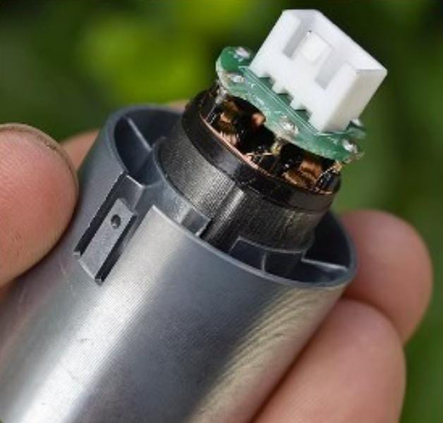 High-voltage Brushless Ducted Fan 110000 RPM Edf Motor With Aluminum Alloy Impeller & Variable Frequency Control - close-up of the silver cylindrical housing, exposed copper wiring, and the white electrical connector port.