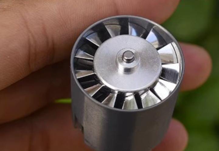High-voltage Brushless Ducted Fan 110000 RPM Edf Motor With Aluminum Alloy Impeller & Variable Frequency Control - close-up view of the metallic impeller blades and central shaft held in a hand.
