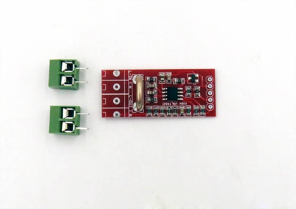 HLW8012 High Precision Energy Metering Module Arduino Energy Monitoring - a red circuit board with a chip and two separate green screw terminal connectors on a white background.