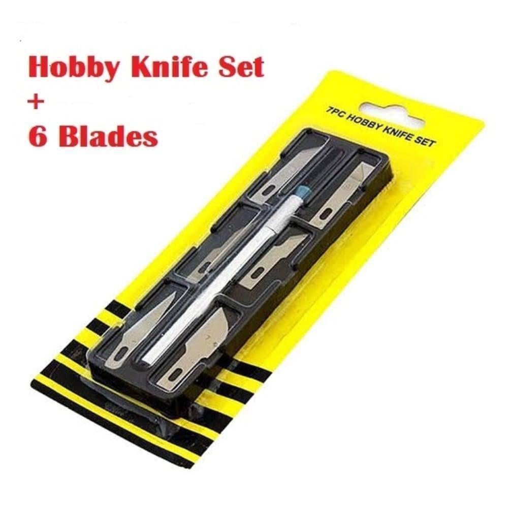 Hobby Knife Set 7pc - shown in its original yellow and black retail packaging containing one silver hobby knife handle and six assorted metal blades.