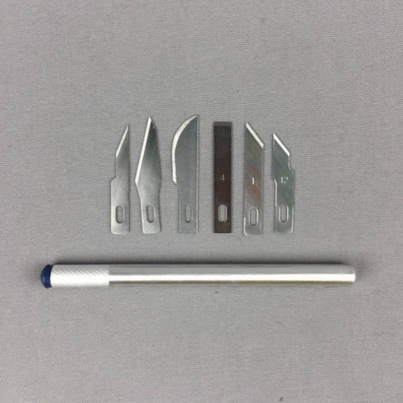 Hobby Knife Set 7pc - a silver metal handle and six assorted interchangeable steel blades arranged on a grey background.