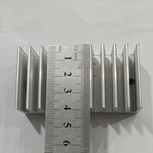 Hot Aluminum Alloy Heatsink Cooling Pad For High Power LED IC Chip Cooler Radiator Heat Sink For LED COB Light - shown with a metal ruler measuring its length, which is approximately 5.5 centimeters.