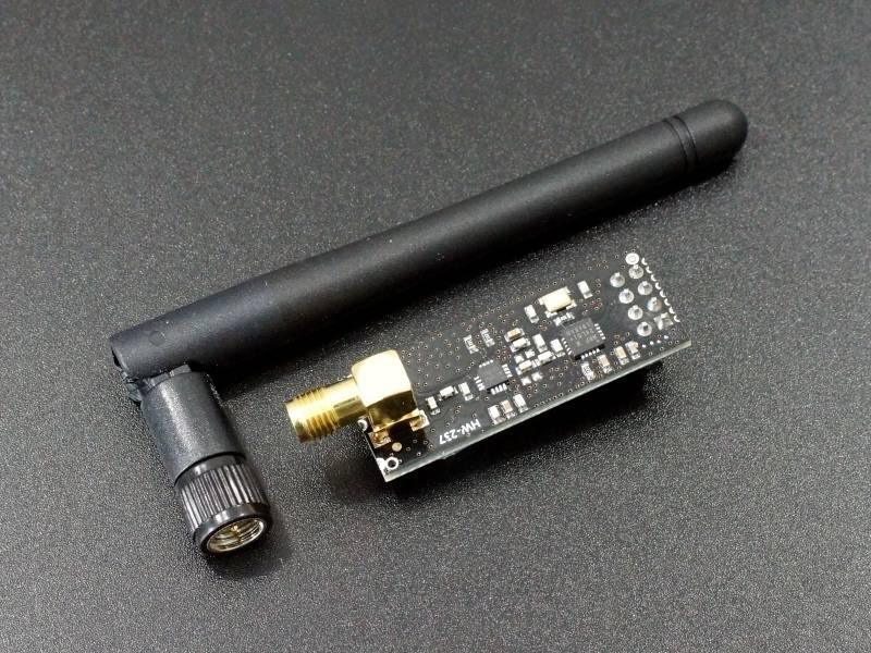 Hw-237 2.4GHz NRF24L01+pa+lna SMA Wireless Transceiver Module With Antenna - black PCB, gold SMA connector, and a detachable black antenna on a dark surface.