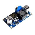HW-411A LM2596 DC To DC Buck Converter Step Down Module Power Supply - a blue circuit board featuring a silver capacitor, a black inductor, and a small brass adjustment screw.