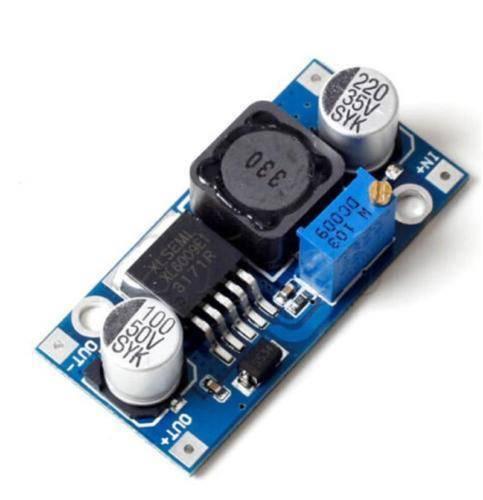 Hw-432 XL6009 DC To DC Boost Converter Voltage Booster - a blue rectangular circuit board with a black inductor, a silver potentiometer, and two cylindrical capacitors.