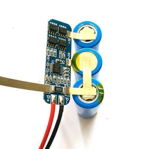 Hx-3s-1 Lithium Battery 3s 12V 10A Charge Protection Board BMS Pcm For 18650 Li-ion Cells Charging - connected to three blue 18650 cylindrical cells with red and black output wires.