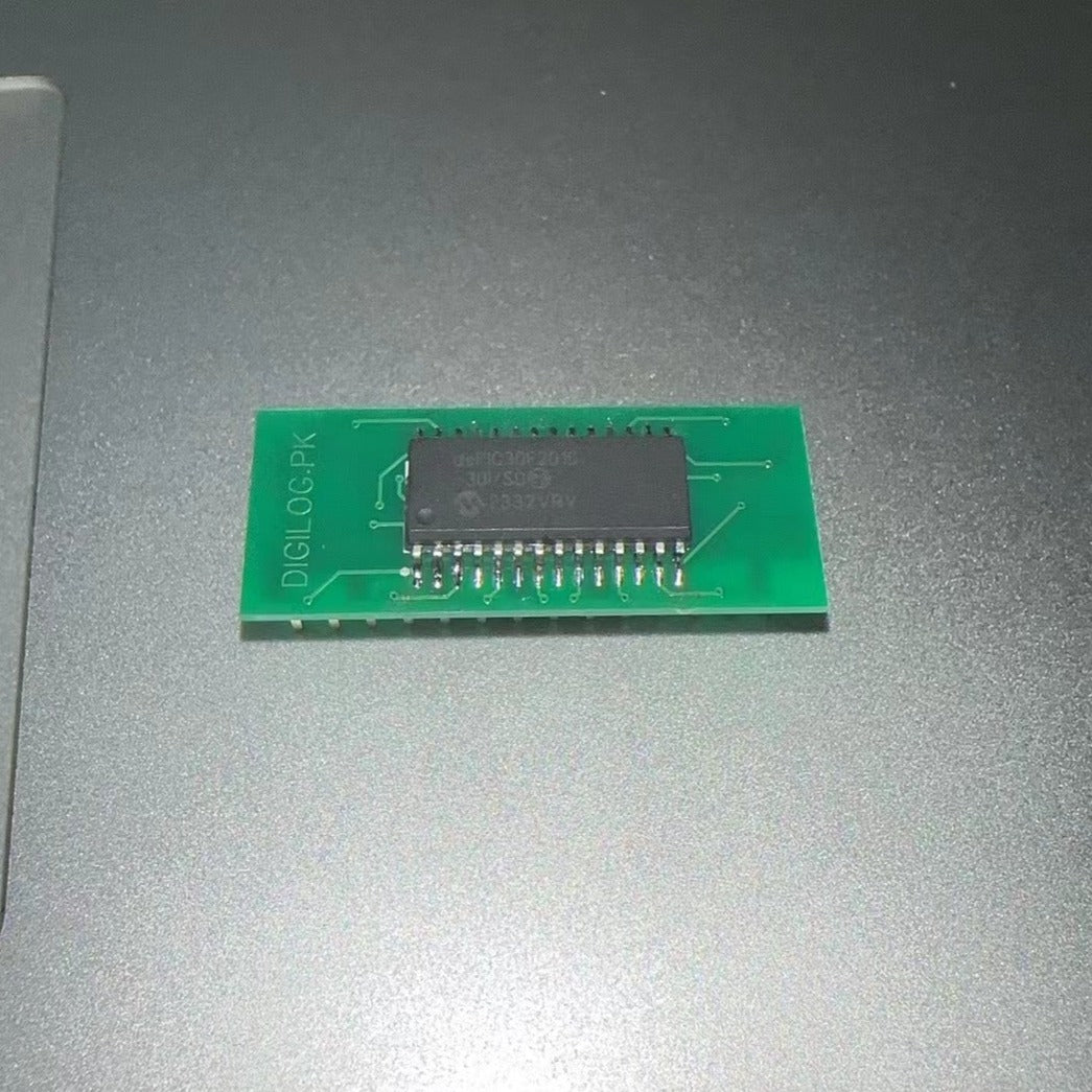 IC Base With Header SMD DSPIC30F2010 - green rectangular circuit board featuring a black integrated circuit chip soldered in the center.