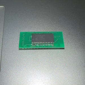IC Base With Header SMD DSPIC30F2010 - green rectangular circuit board featuring a black integrated circuit chip soldered in the center.