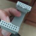 IDC/ide 16PIN Flat Ribbon Cable With IDC Connector - shown as a grey, multi-wire ribbon cable with a 16-pin IDC connector attached to each end.