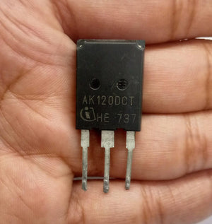 IGBT AK120DCT He-737 120A 600V - High-efficiency Power Transistor - a black three-pin power transistor held in a hand, showing the model number and manufacturer logo printed on its front surface.