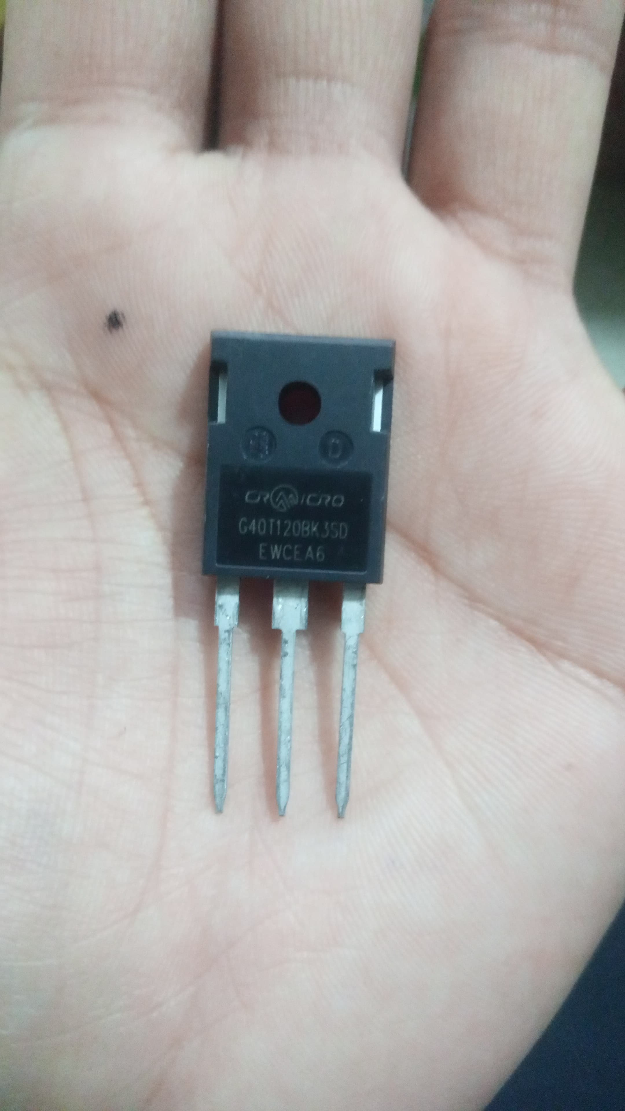 IGBT G40T120BK3SD - High Power 1200V 40A Transistor For Inverters & Motor Drives - a black, rectangular three-pin transistor held in a palm, showing the printed model number and manufacturer logo on its front surface.