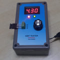 IGBT Tester - in a grey rectangular box with a blue faceplate, featuring a digital display showing 4.30, a rotary knob, two indicator lights, and a terminal.