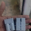 Grey battery connector housings shown from two angles
