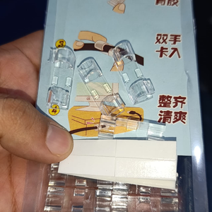 Clear cable clips and adhesive pads shown with product packaging