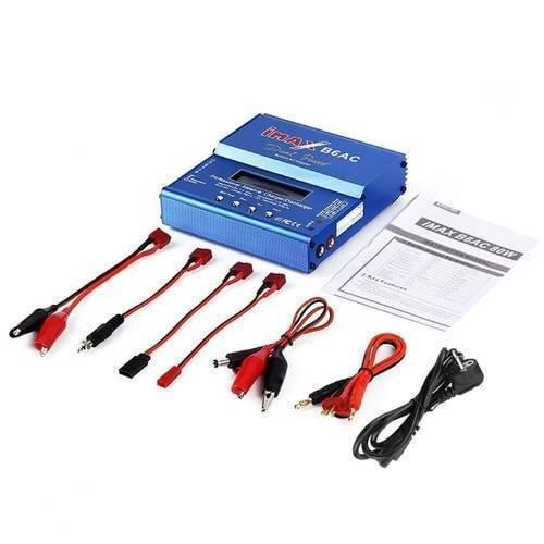 Imax 80W NiMH 3s Rc LiPo Battery Balance Charger Discharger B6ac - with a blue metal housing, LCD screen, four buttons, manual, and various charging cables and power cords laid out on a white surface.